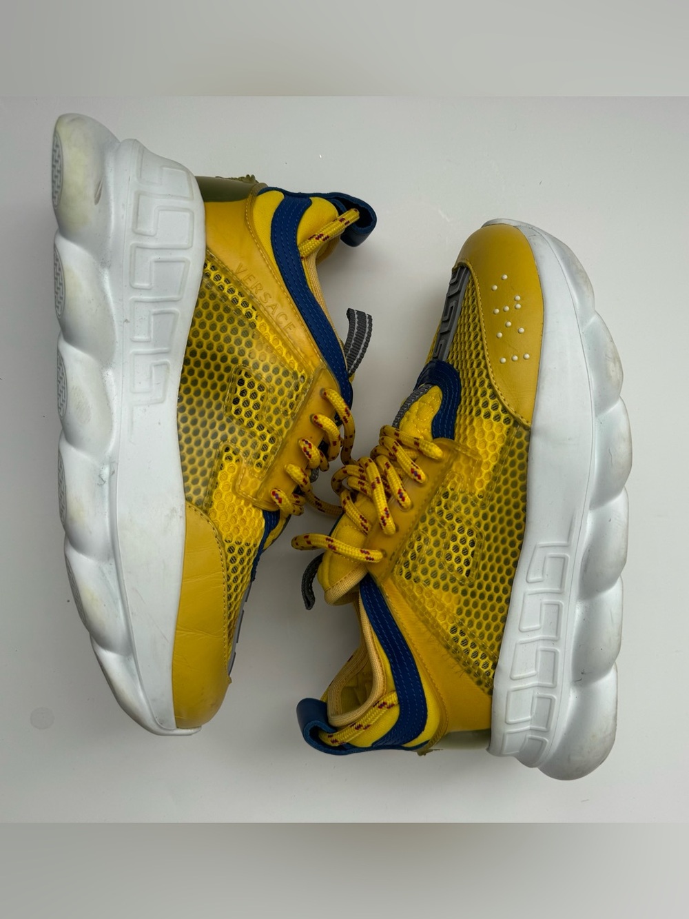 Women’s Yellow Versace Chain Reaction Sneakers.